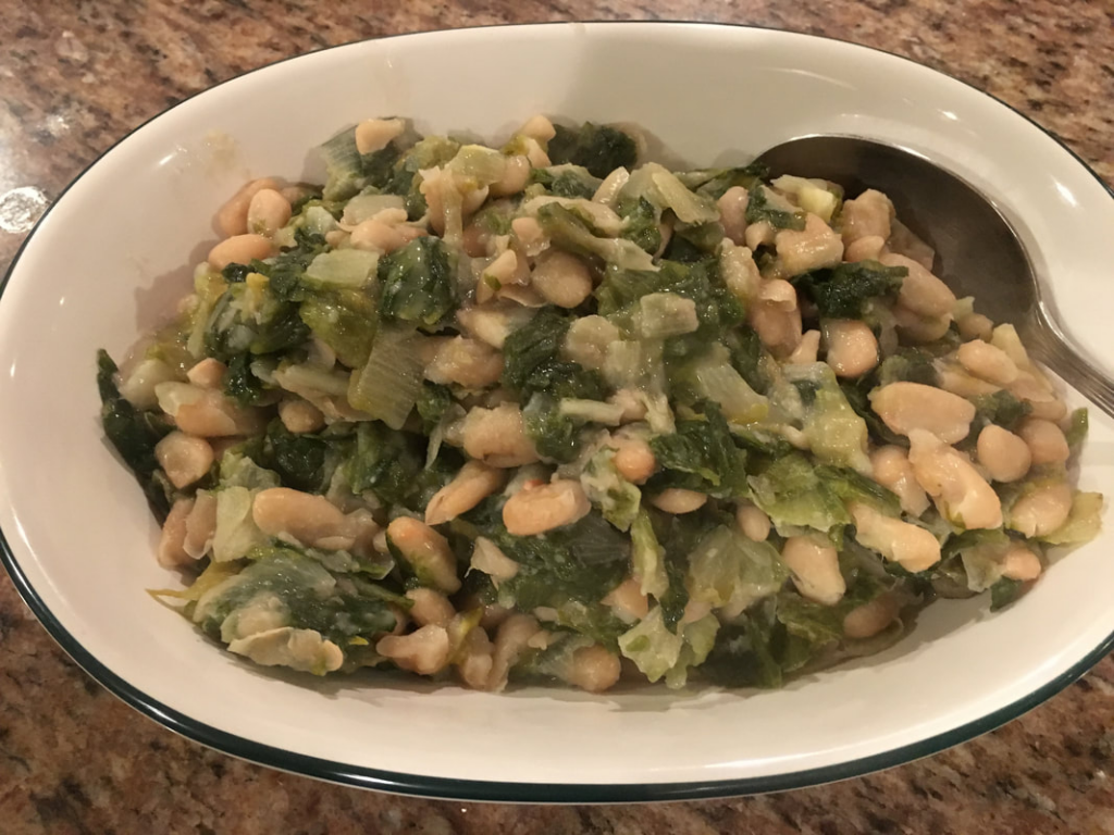 escarole and beans in a platter ready to be served.