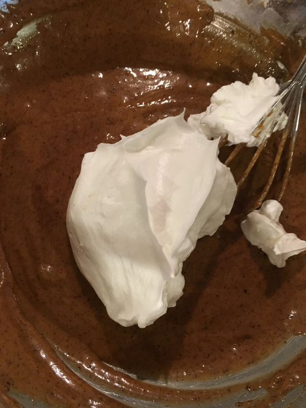 Add some egg whites to the cake batter to loosen up. 