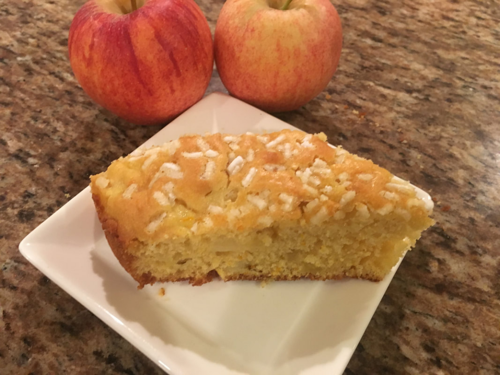 Italian apple cake on a white dish.