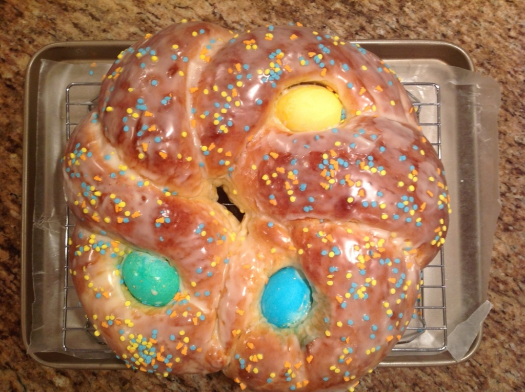 Glazed Italian Easter bread with colored eggs.