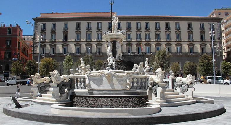 The front of Neptune Fountain in Piazza del Municipio in Naples during daylight. A UNESCO site. 