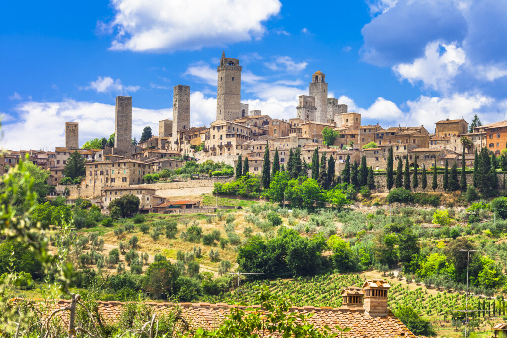 City view of San Gimignano with trees in bloom. A UNESCO site.