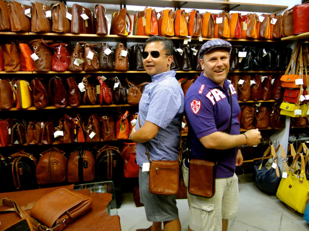 men wearing the man purse in Florence 