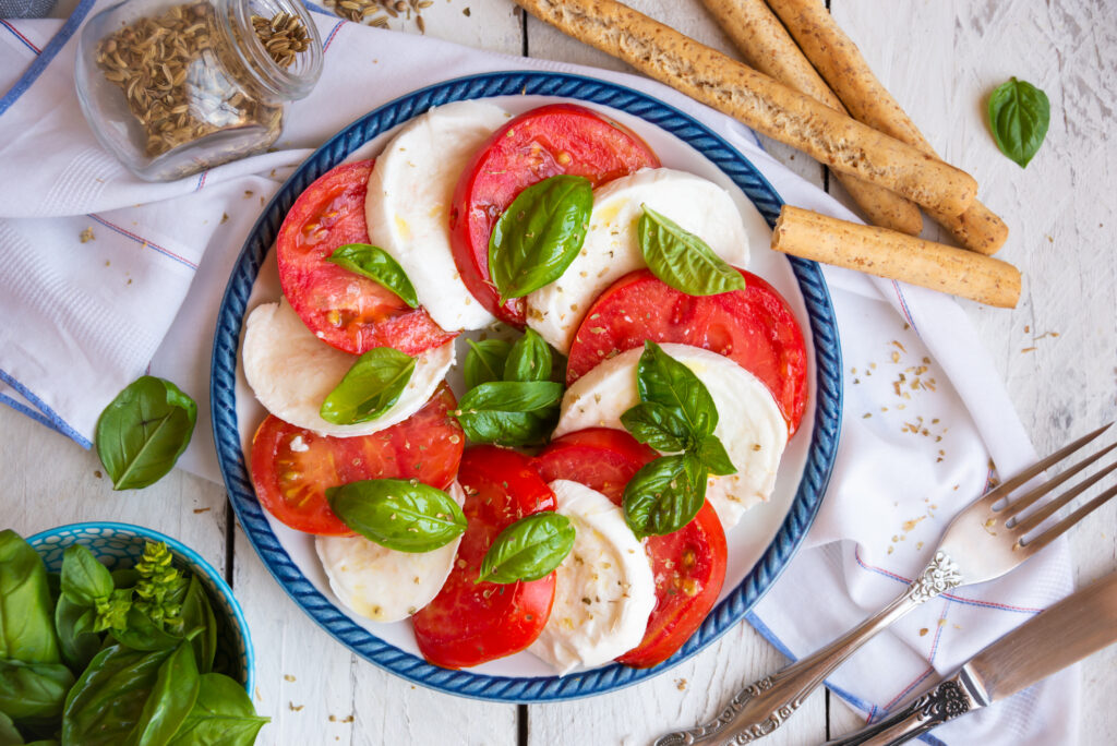 Caprese salad simply decorated with some oil. 