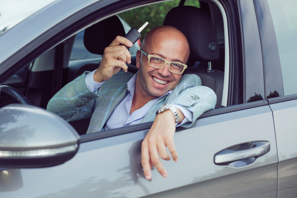 Smiling car driver in Italy.