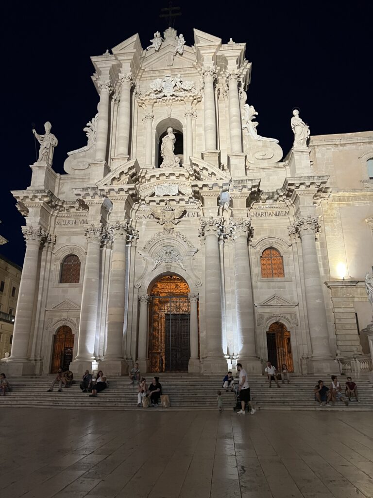 nighttime view of the duomo in Ortigia. One of Italy's Most Beautiful Churches.