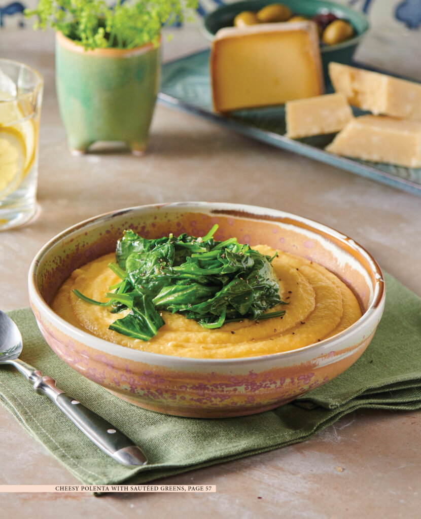 Cheese polenta with sautéed spinach on top.