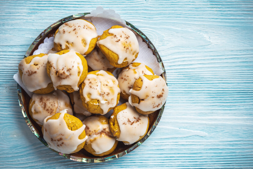 plated pumpkin cookies iced. 