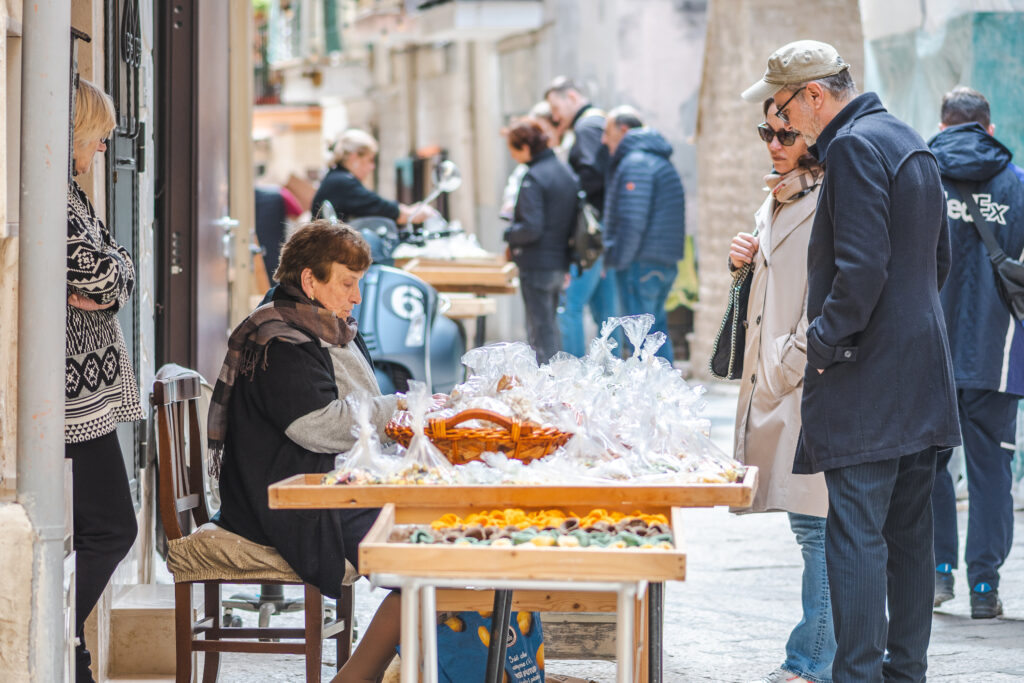 Ladies in Bari Italy selling broccoli rabe. 